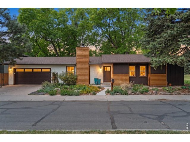 Property Photo 2 New cedar panels and exterior paint. Garage door replaced in 2023. 