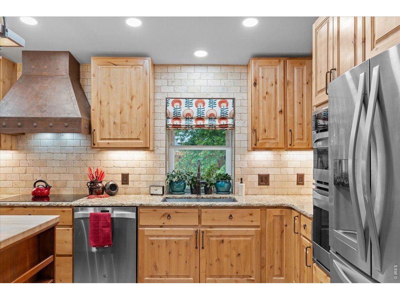Updated tile backsplash, bump out kitchen windows and large sink. 