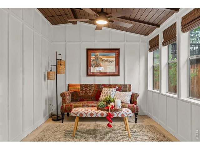 Property Photo 26 Enclosed back porch offers great additional hosting space!