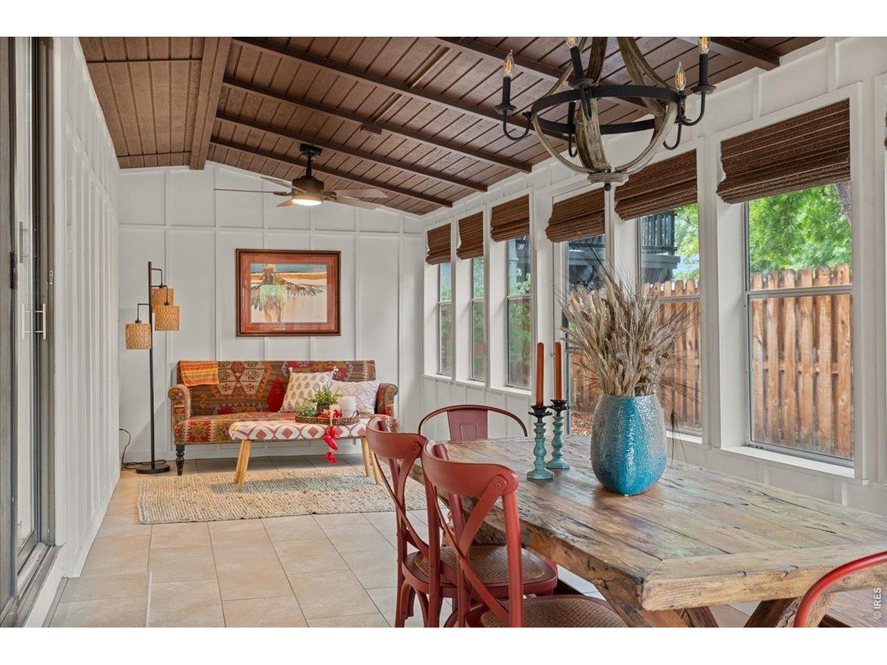 Newer windows, shades, ceiling light fixture, ceiling fan and floor tile. 