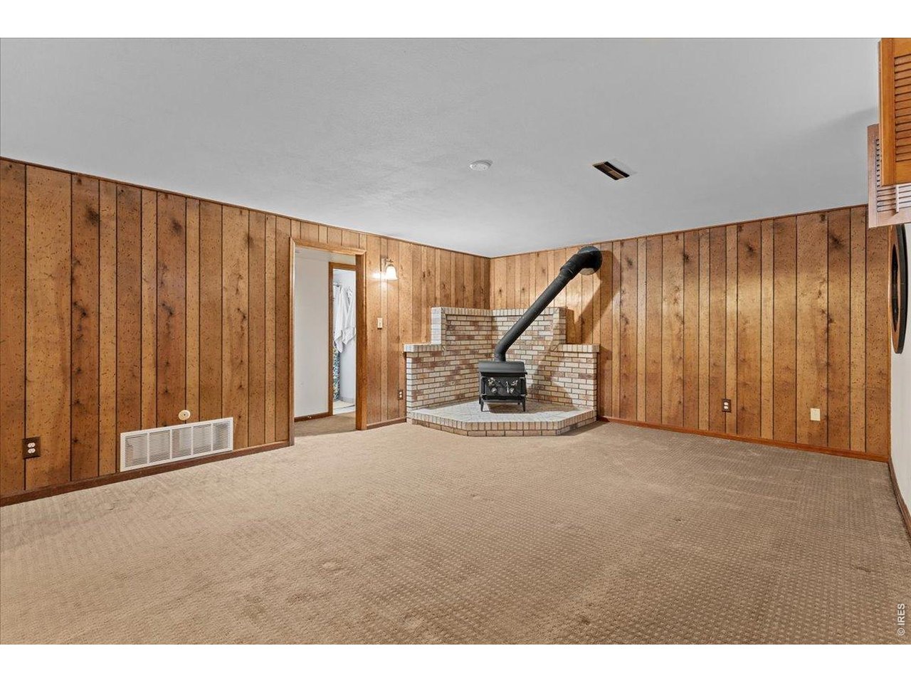 Family room or office in the basement, connected to a 3/4 bath and bedroom