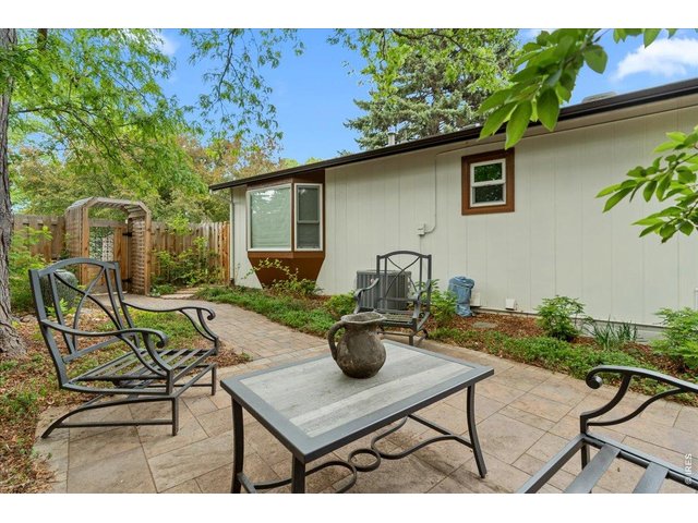 Property Photo 43 Private backyard space with shade tree. 