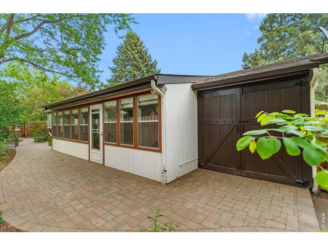 Property Photo 44 Outdoor attached shed for additional storage space. 