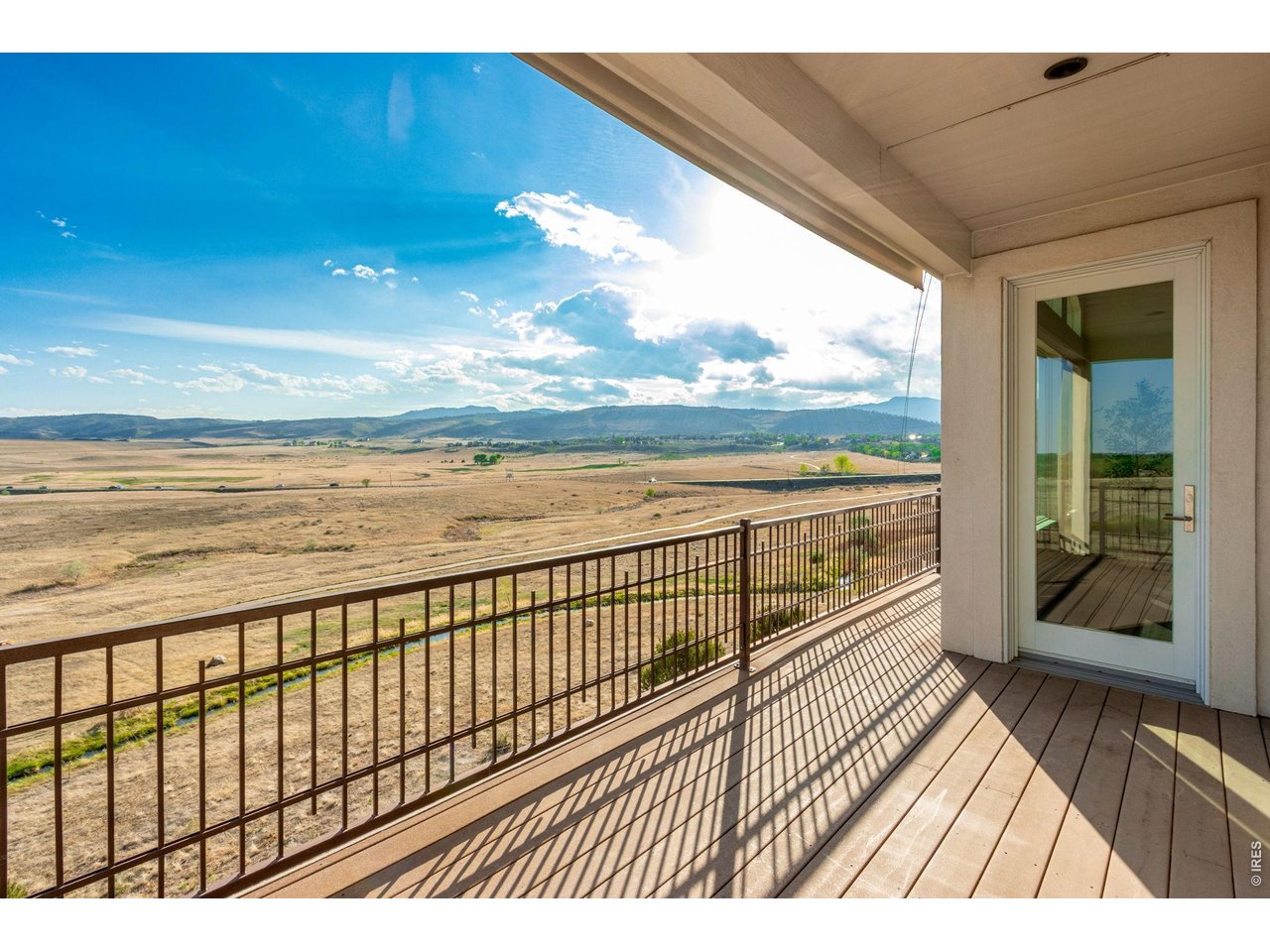 Gorgeous Stucco and Stone exterior - custom welded rails, and 4 composite decks all covered - one has a BBQ gas line, ready for the best in easy Colorado Outdoor Living! Prime Triple Glaze Andersen Casement Windows! 