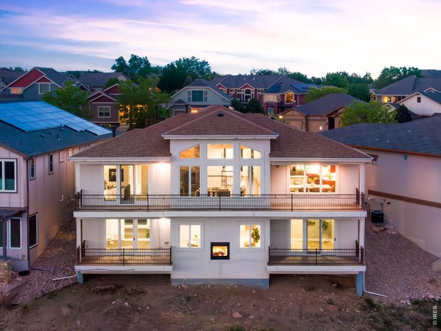 Property Photo 3 3 fireplaces, Custom Patio Home- stucco and stone and custom welded rails, 4 covered decks. 