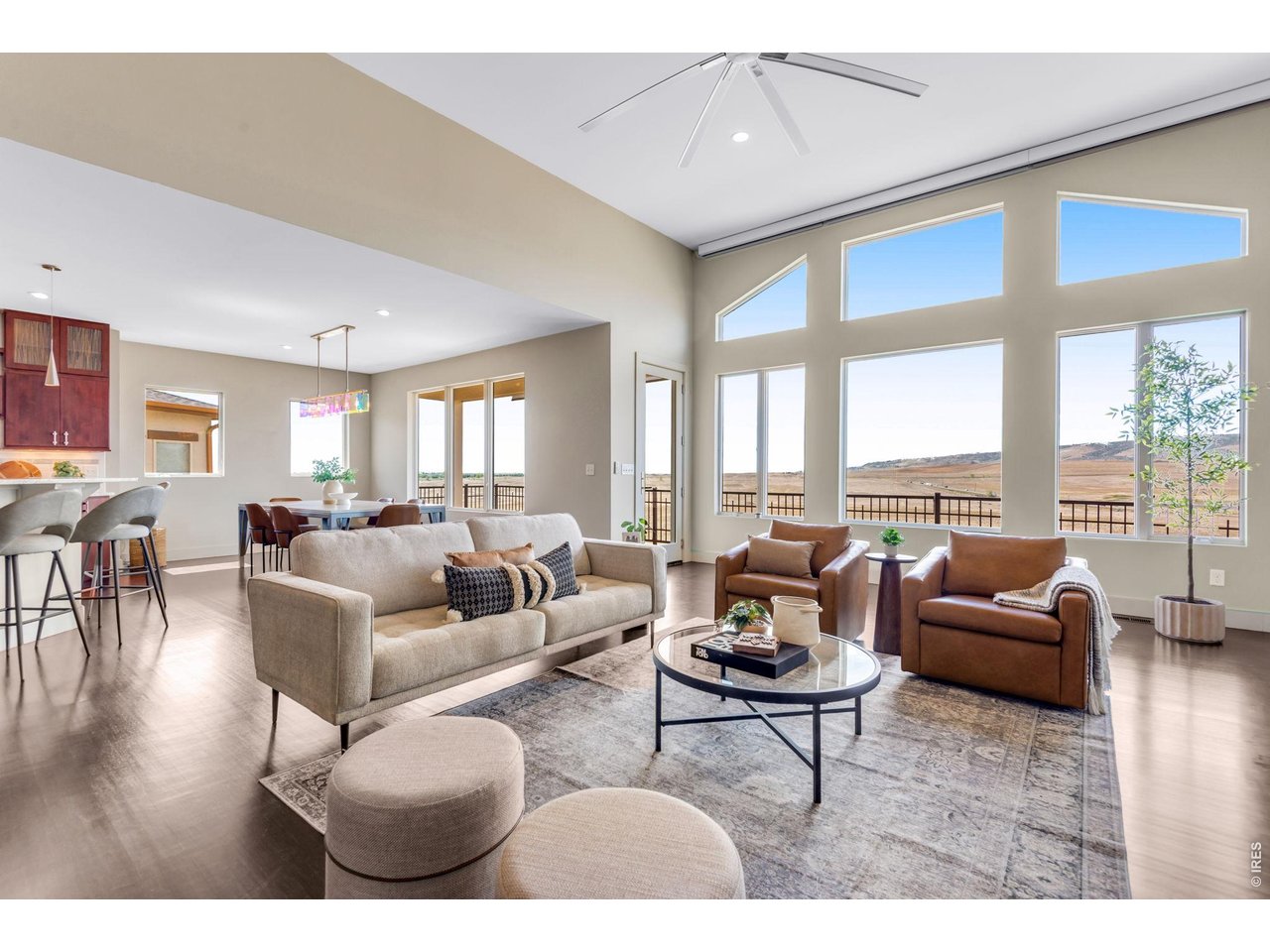 Easy flow layout, and Bamboo floors across the entire Great Room, dining room area! Phenomenal layout for entertaining. Custom Motorized Window Treatments by Lutron - Smart Bridge/Automated -Lutron App.