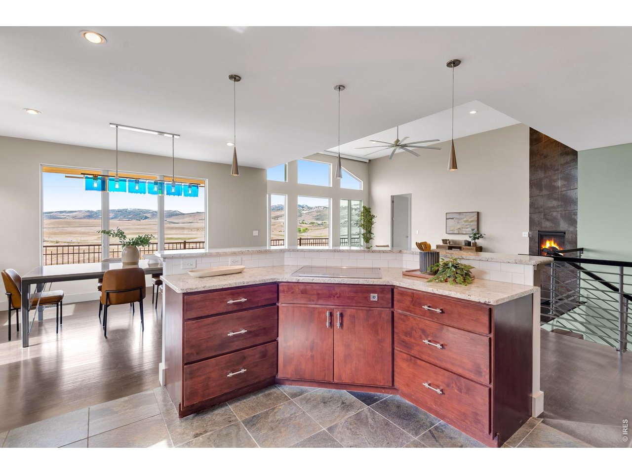 Dining Room Table (included) was custom made to match the feature staircase! Local Tharp custom cabinetry, -decadent eat-in Kitchen. Heathly Induction Range! 