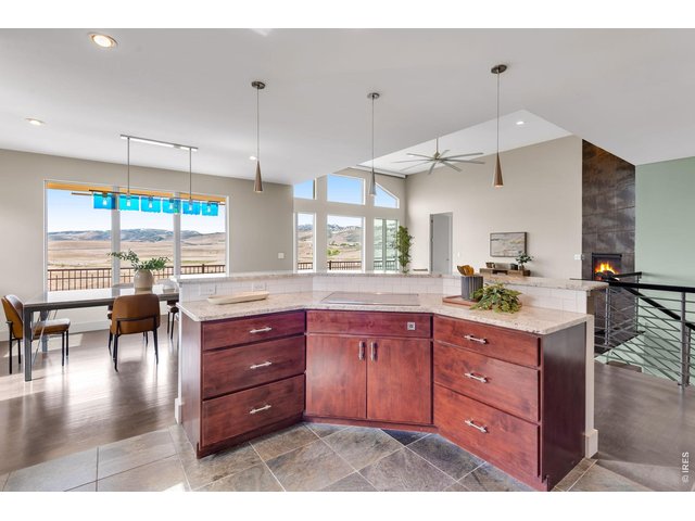 Property Photo 22 Dining Room Table (included) was custom made to match the feature staircase! Local Tharp custom cabinetry, -decadent eat-in Kitchen. Heathly Induction Range! 