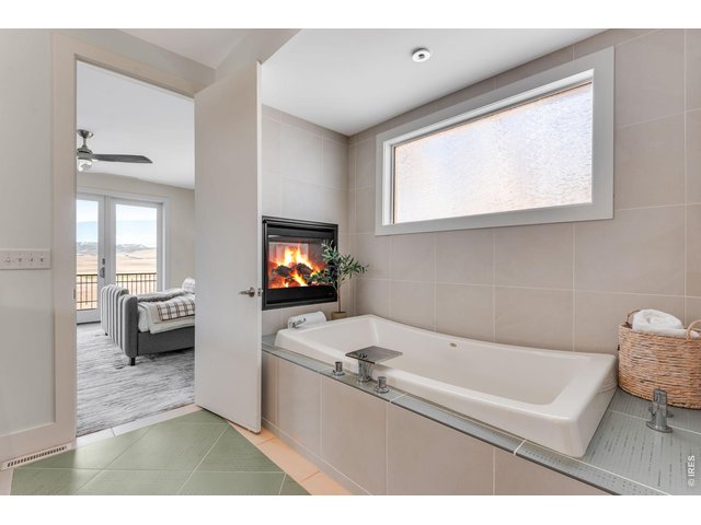 Property Photo 11 All main level interior doors are solid core 8-0' slabs. Oversized Soaking tub with ceiling faucet. Integrated Culligan Water Softner for showers and baths! 
