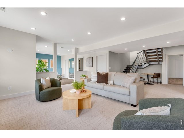 Property Photo 41 Beautiful Feature Floaing Bamboo HW stairs and custom welded rails transition to the finished Lower Level! 