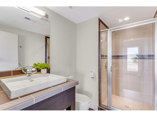 Property Photo 48 Additional 3/4 Bathroom in the finished lower level. Great suite for a guest stay or work-out area, yoga flexpace. 