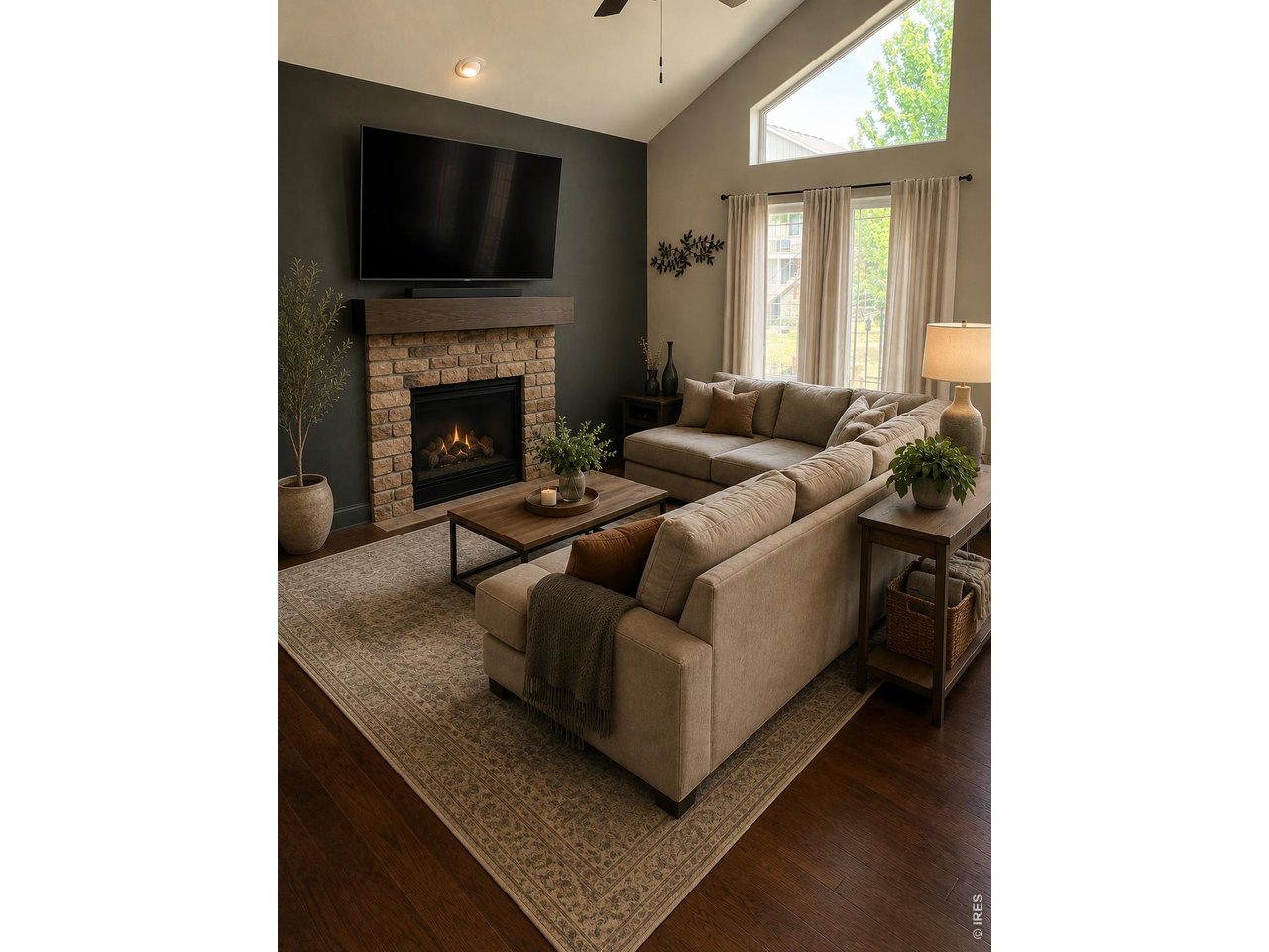 Great Room with Stone Gas Fireplace & Vaulted Ceilings