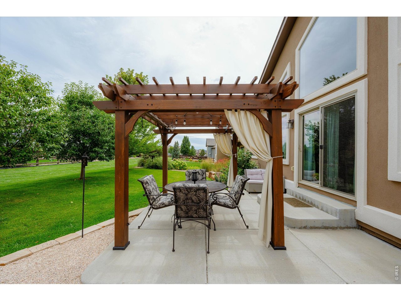 Charming Outdoor Sitting Space & Extended Patio! Mature Trees line the Back of the Property Line for Extra Privacy & Beauty!