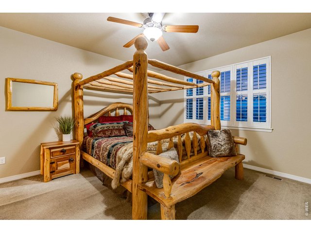 Property Photo 19 Primary bedroom with retreat features a ceiling fan 