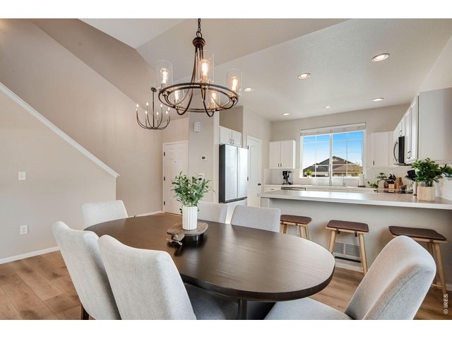Property Photo 9 Soaring Vaulted Ceilings. Warm neutral modern colors - entire interior JUST painted all walls, casing & trim and new custom light fixtures! 