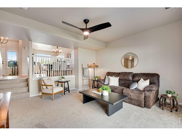 Property Photo 4 Comfortable Living Room space, upgrade ceiling fan, plush new carpet and pad, fresh paint - spacious & fresh! 