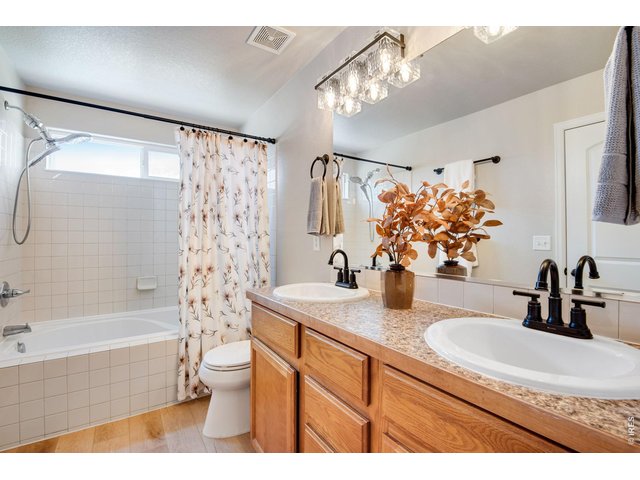 Property Photo 27 Primary Full Bathroom Suite, new LVP floors, new faucets, and lighting, paint and - 36" taller vanity sinks and comfort height toilet! 