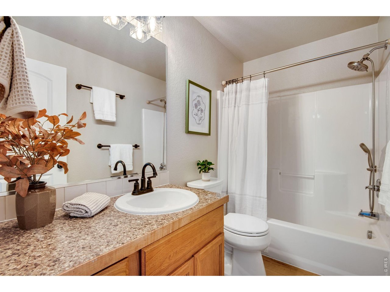 Full Secondary Bathroom, new faucet, lighting and floors and paint and toilet! 