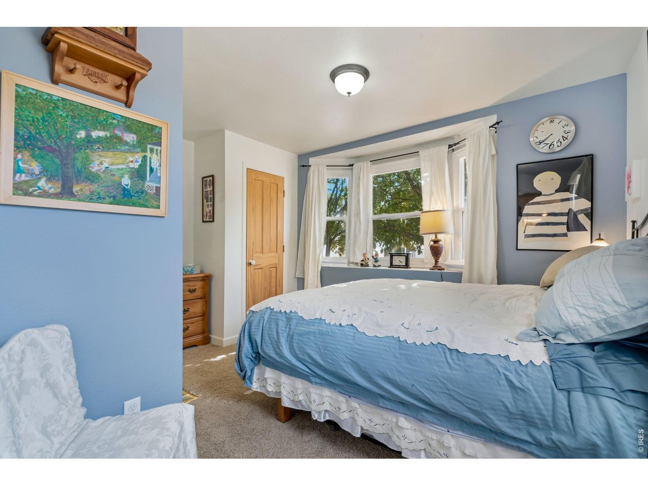 Secondary bedroom (13x8) at the front of the home with bay window.