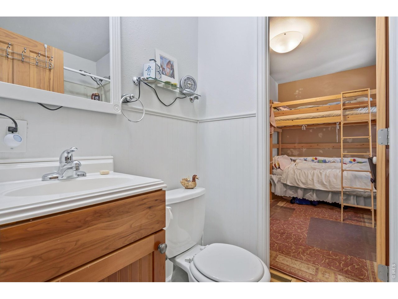 Jack n Jill 3/4 bathroom in between two front secondary bedrooms.