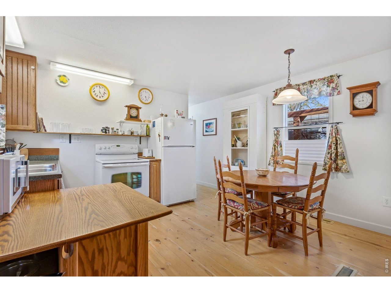 Kitchen with pine wood floors.