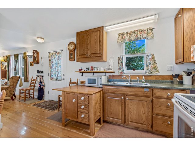 Property Photo 11 Kitchen opens to living room.