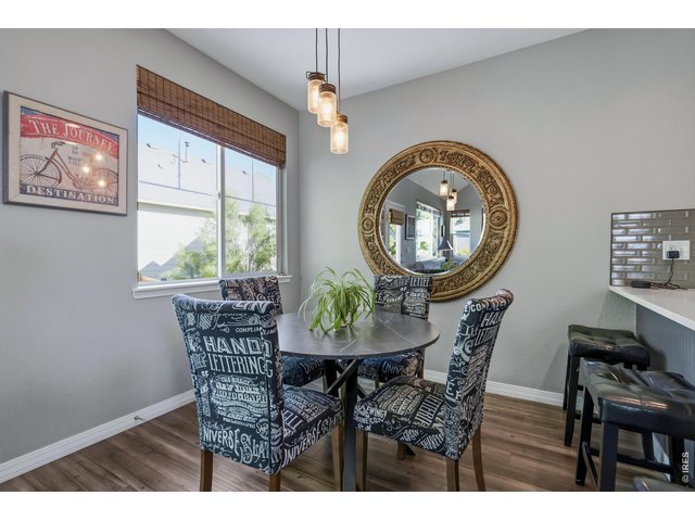 Property Photo 9 Dining area off the kitchen with a large west window.