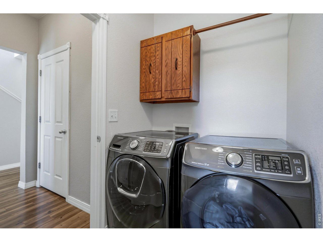 Laundry area conveniently located and lots of storage.