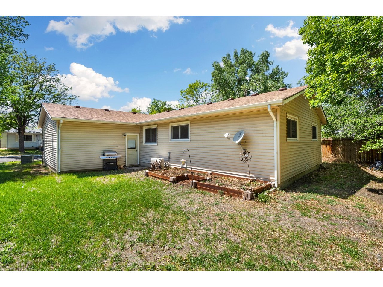 Great Yard with mature trees and raised beds
