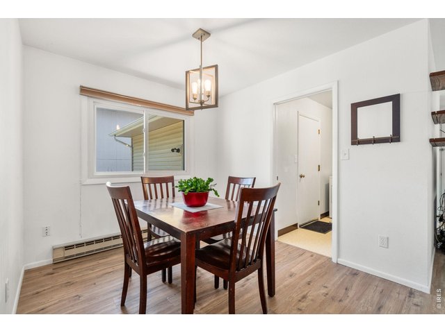 Property Photo 8 Dining Room with doorway to Laundry Room and the Entrance to the Garage