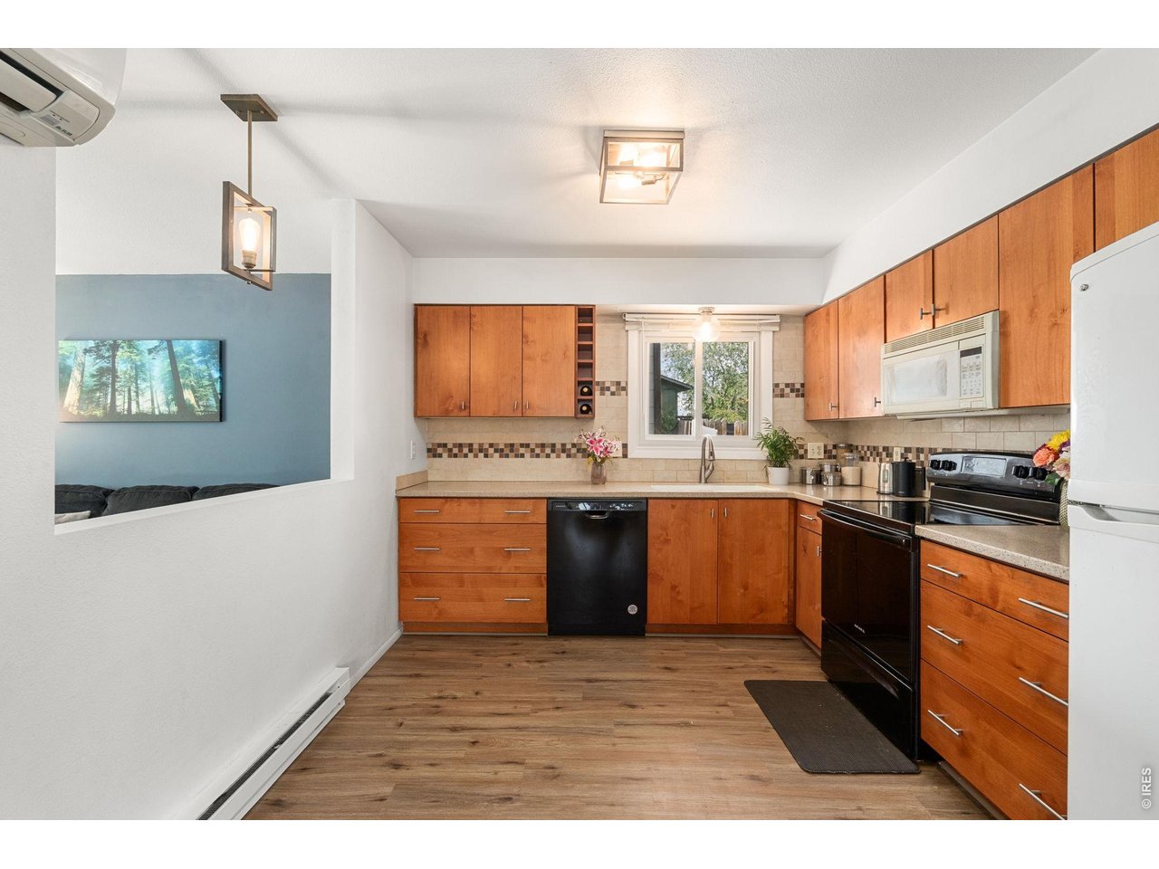 Kitchen with open wall to Living Room