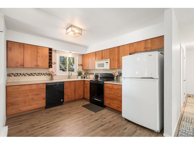 Property Photo 9 Upgraded kitchen with lots of cabinets and corian countertops