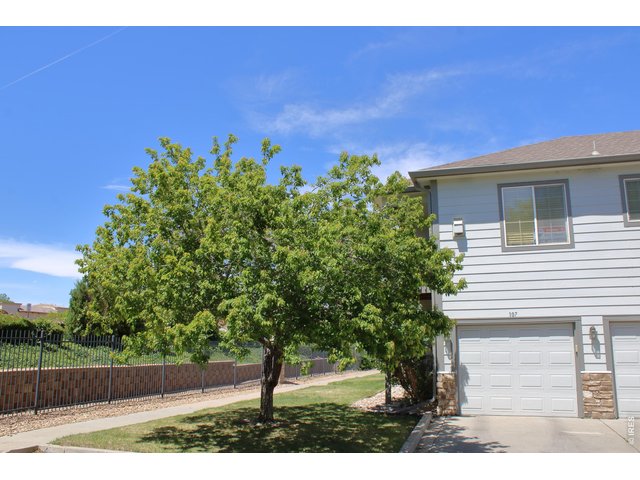 Property Photo 4 Includes an attached garage with opener. Plenty of additional parking across from garage.