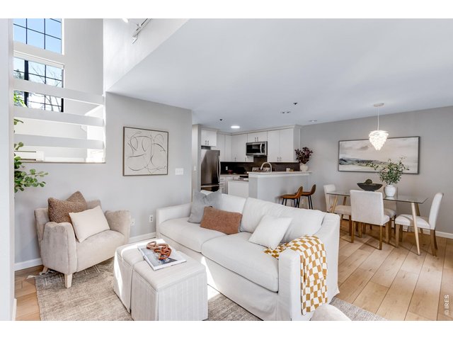 Property Photo 2 Remodeled contemporary feel, with Soaring/Vaulted ceilings and large picture windows that create a luminous interior. 2 Bedroom/2 Bath, Stunning all new luxury vinyl plank flooring.