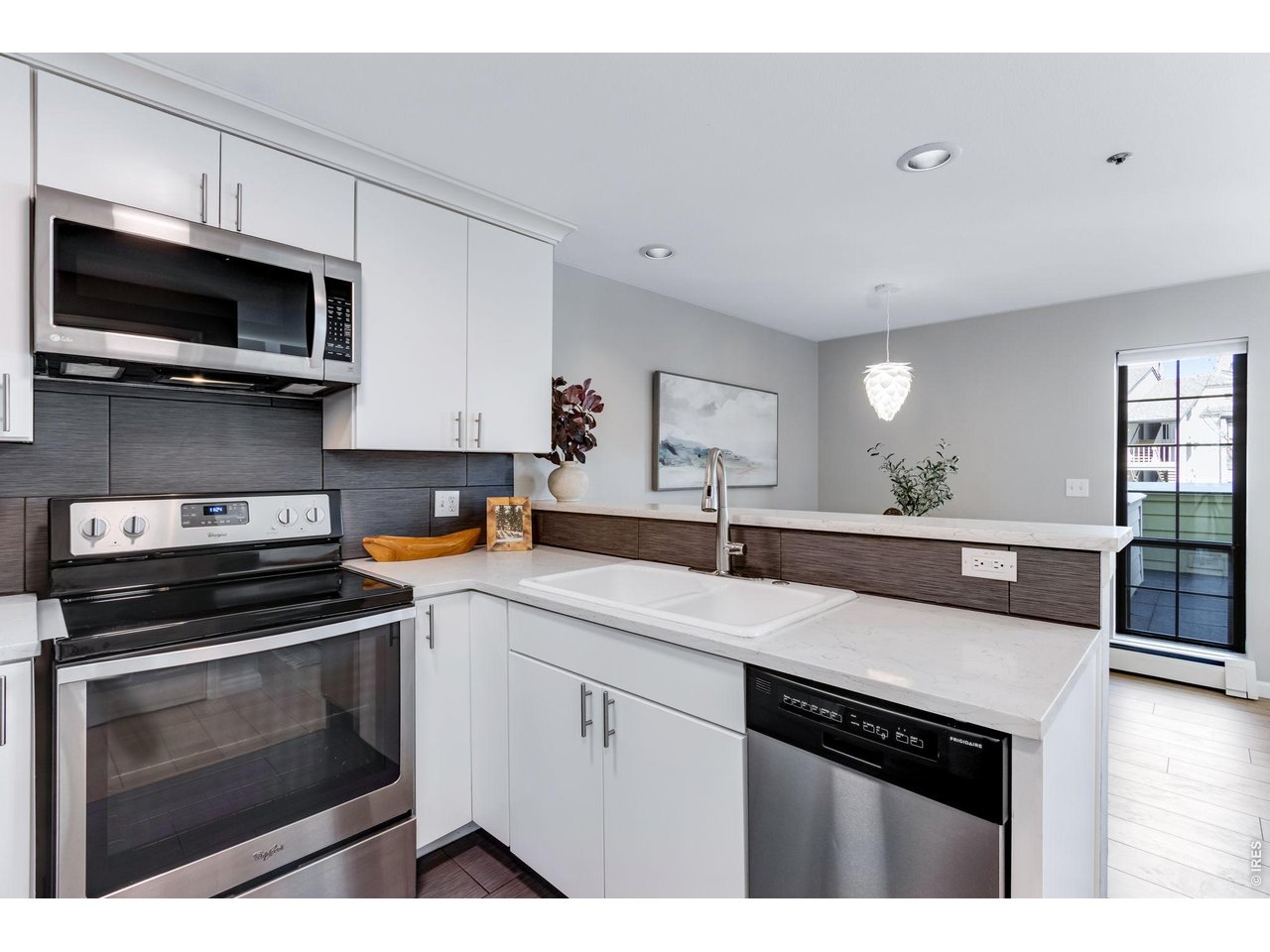 All white modern cabinetry with dove-tail joints and soft close drawers. 2 lazy susans that flank the range