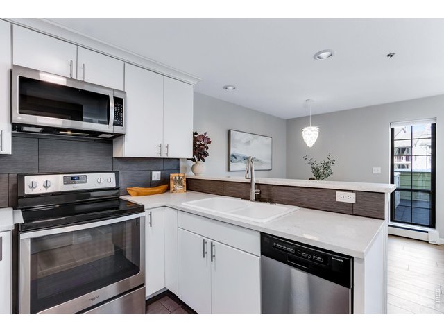 Property Photo 3 All white modern cabinetry with dove-tail joints and soft close drawers. 2 lazy susans that flank the range