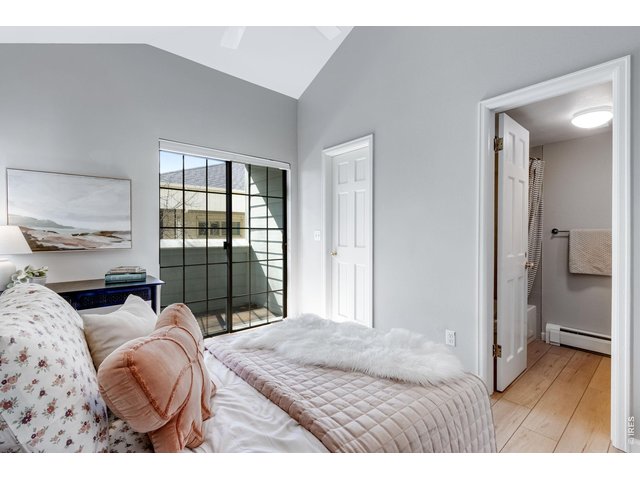 Property Photo 12 Main level Bedroom ensuite - opens to a balcony - newer slider door on order to be installed prior to closing.