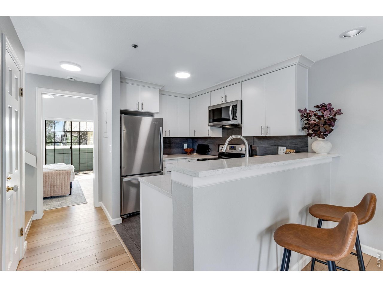 Convenient walk-in pantry across from the kitchen area, Quartz breakfast bar.