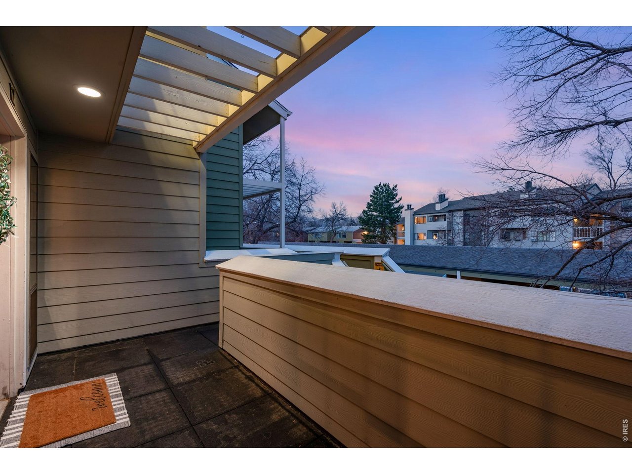 Welcoming private front porch with ample space.