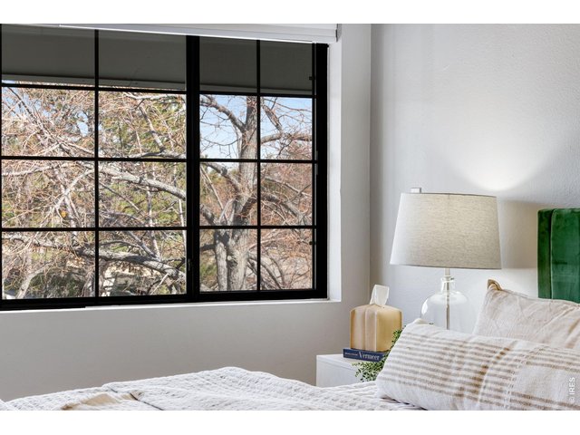 Property Photo 17 Expansive windows that invite natural light, upper level primary suite.