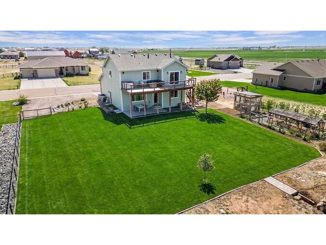 Property Photo 38 Massive lawn area with full sprinkler and drip system