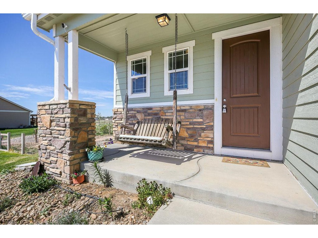 Unwind on the inviting front porch - swing is included!