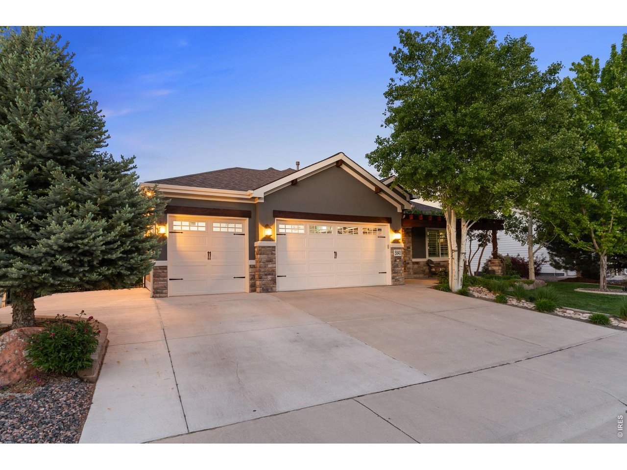 Large FINISHED 3 car garage w/ extra parking on the to left of single car garage
