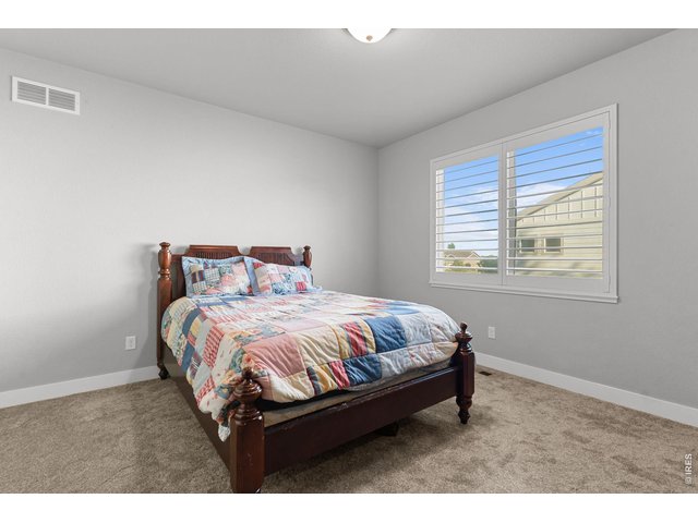 Property Photo 25 Guest room...notice plantaion shutters!