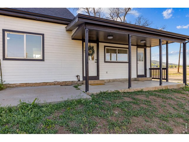 Property Photo 4 Main entry with covered porch.