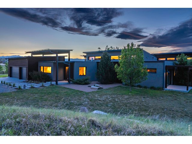 Property Photo 2 Front Exterior with Solar Panels