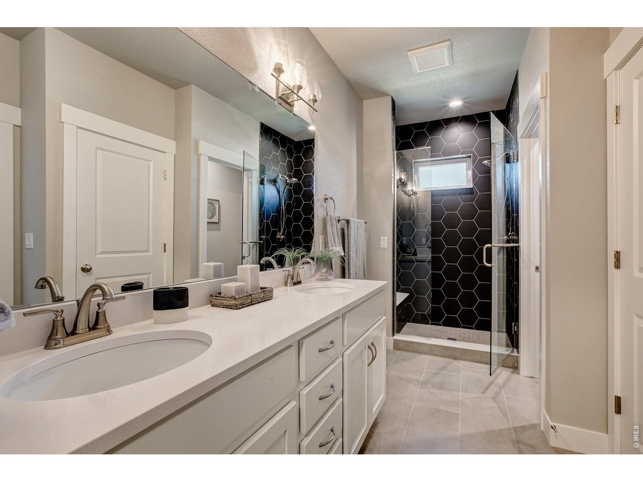 Property Photo 21 Primary bathroom with dual vanities. Photos of a previously built Barrington II. 