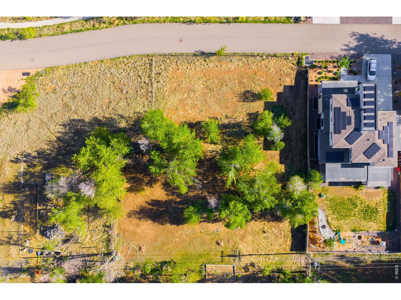 This level lot provides flexibility for either a larger single-family residence or two smaller single-family homes, with existing city water and sewer connections already in place.