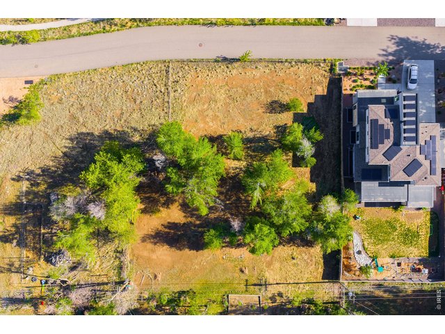 Property Photo 2 This level lot provides flexibility for either a larger single-family residence or two smaller single-family homes, with existing city water and sewer connections already in place.