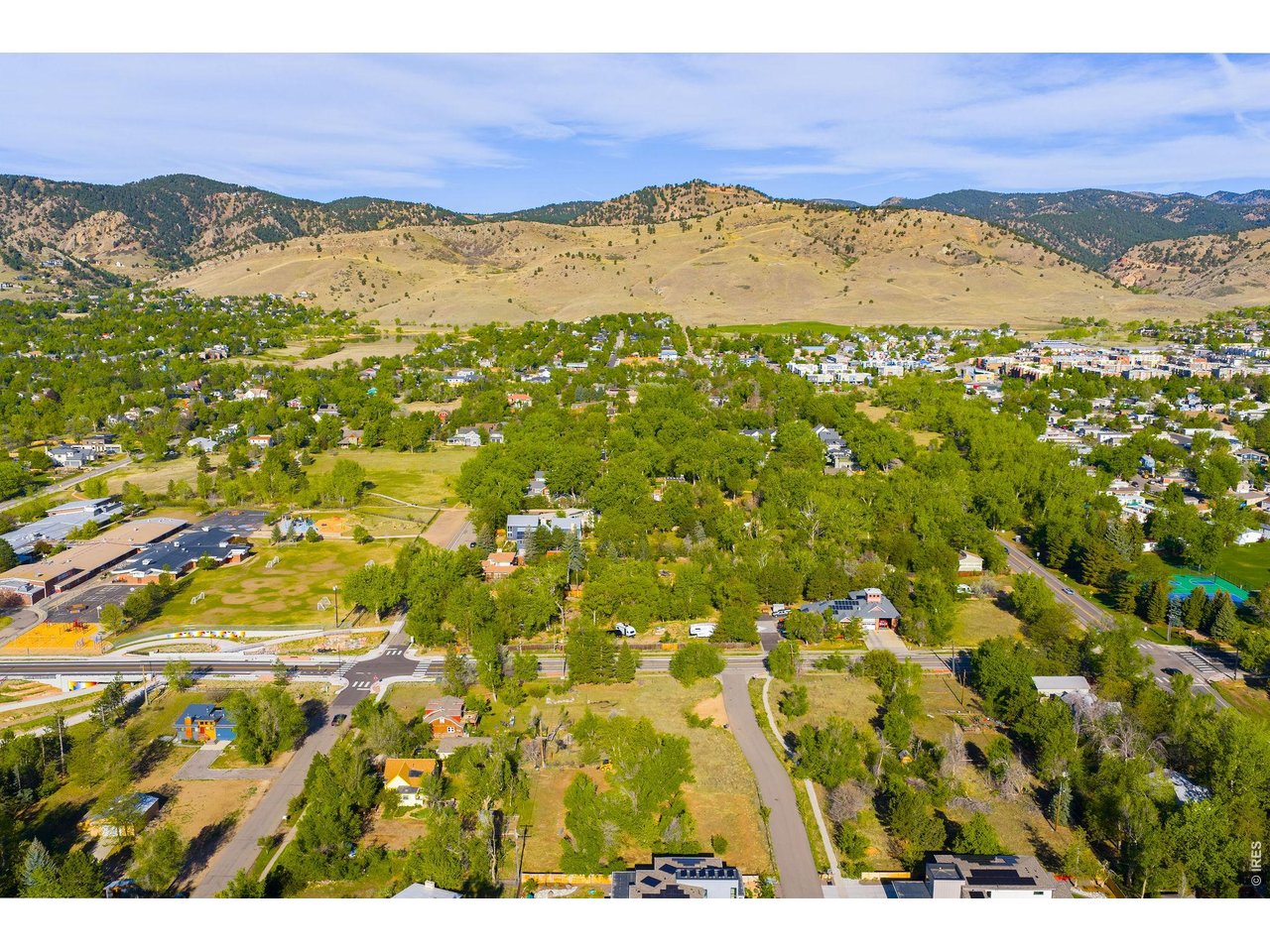 Positioned toward the quieter southwest end of Vine Avenue, the property offers a peaceful residential setting with Flatiron views and immediate access to many of North Boulder's most sought-after amenities.
